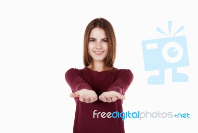 Smilling Woman Offering At You Stock Photo