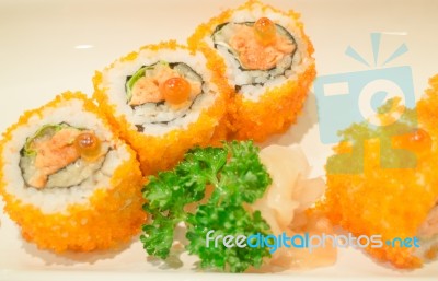 Smoked Salmon Sushi Roll On Plate Stock Photo