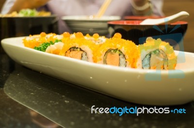 Smoked Salmon Sushi Roll On Plate Stock Photo