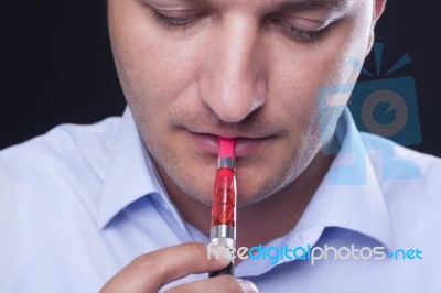 Smoking Electric Cigarettes Stock Photo