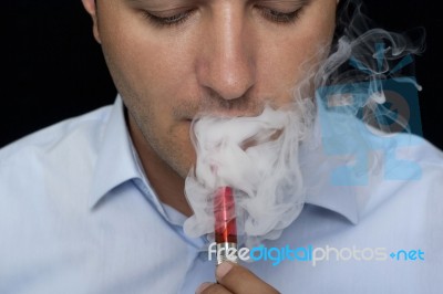 Smoking Electric Cigarettes Stock Photo