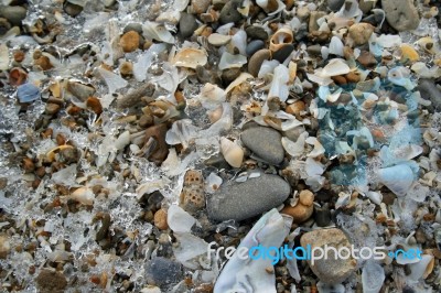 Snow, Ice, Shells & Stones On A Winter Beach Stock Photo