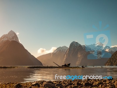 Snowcaped Mountains With A Lake Glassy Shore Stock Photo