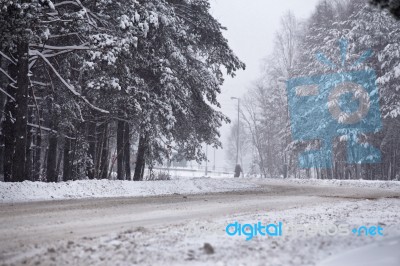 Snowfall And Sleet On Winter Road. Ice Snowy Road. Winter Snowst… Stock Photo