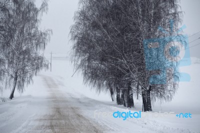 Snowfall And Sleet On Winter Road. Ice Snowy Road. Winter Snowst… Stock Photo