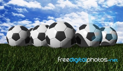 Soccer Balls On Green Grass Stock Image