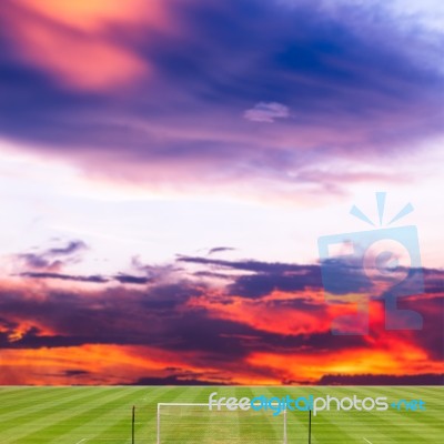 Soccer Field With Beautiful Sunset Background Stock Photo