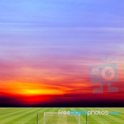 Soccer Field With Beautiful Sunset Background Stock Photo