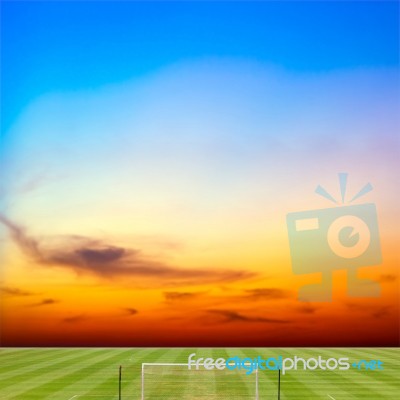 Soccer Field With Beautiful Sunset Background Stock Photo