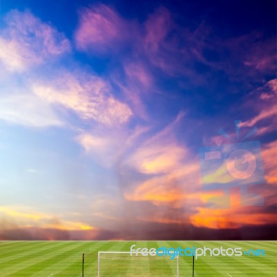 Soccer Field With Beautiful Sunset Background Stock Photo