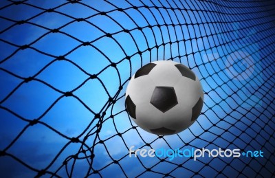 Soccer Football And Goal Net On Blue Background Stock Photo