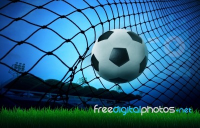 Soccer Football In Goal Stock Photo