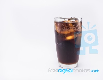 Soft Drink Is Cool With Ice Cubes In Full Glass On White Background Stock Photo