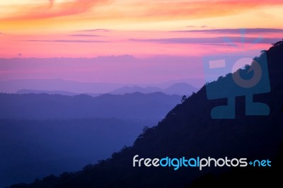 Soft Focus And Blur Beautiful Landscape On The Top Of Mountains With The Sun At Dawn Stock Photo