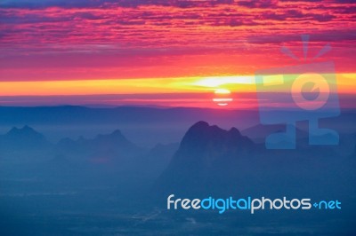 Soft Focus And Blur Beautiful Landscape On The Top Of Mountains With The Sun At Dawn Stock Photo