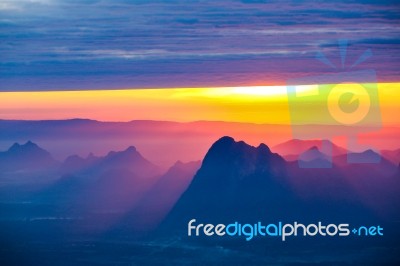 Soft Focus And Blur Beautiful Landscape On The Top Of Mountains With The Sun At Dawn Stock Photo