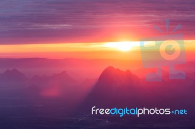 Soft Focus And Blur Beautiful Landscape On The Top Of Mountains With The Sun At Dawn Stock Photo