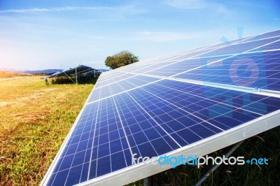 Solar Panels With The Light At Sky Stock Photo