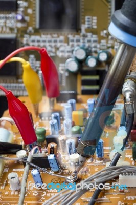 Soldering Iron On Electronic Boards Stock Photo