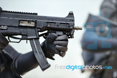 Soldier Carrying Gun Stock Photo