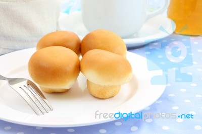 Some Buns White Plate On Morning Table Stock Photo