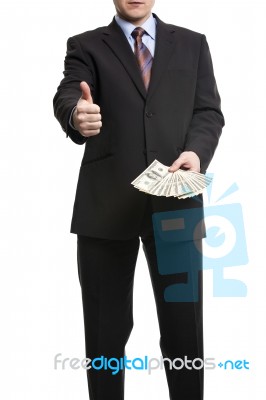 Some Unrecognizable Businessman In Suit Showing  A Spread Of Cas… Stock Photo