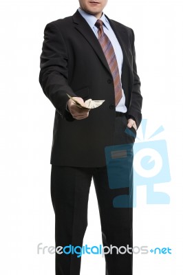 Some Unrecognizable Businessman In Suit Showing  A Spread Of Cas… Stock Photo