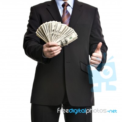 Some Unrecognizable Businessman In Suit Showing  A Spread Of Cas… Stock Photo