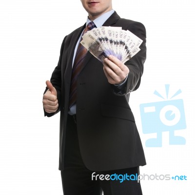 Some Unrecognizable Businessman In Suit Showing A Spread Of Poun… Stock Photo