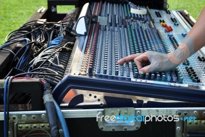 Sound Engineer At Mixing Desk Stock Photo