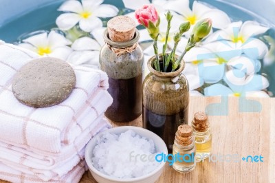 Spa And Wellness Treatment Setup On Wooden Panel Stock Photo