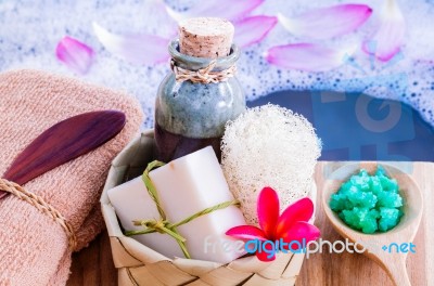 Spa And Wellness Treatment Setup On Wooden Panel Stock Photo