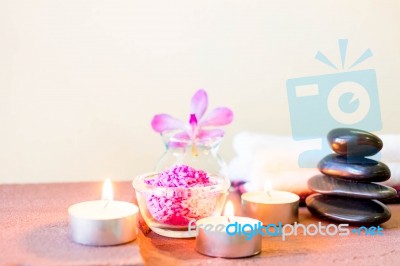 Spa Composition With Candle, Pebbles And Aroma Oil Stock Photo