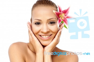 Spa Woman With Lily Flower In Hair Stock Photo