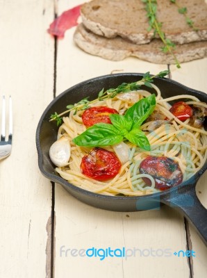 Spaghetti Pasta With Baked Cherry Tomatoes And Basil Stock Photo