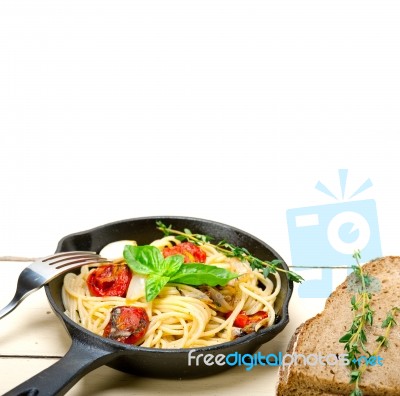 Spaghetti Pasta With Baked Cherry Tomatoes And Basil Stock Photo