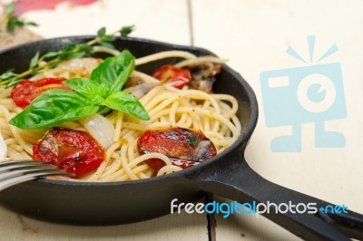 Spaghetti Pasta With Baked Cherry Tomatoes And Basil Stock Photo