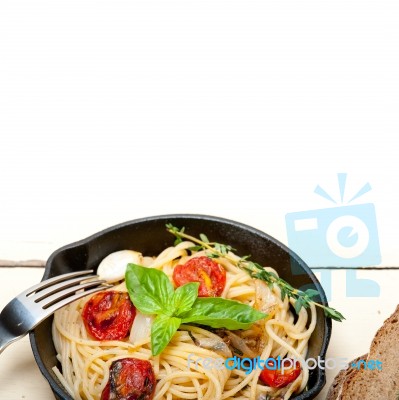 Spaghetti Pasta With Baked Cherry Tomatoes And Basil Stock Photo