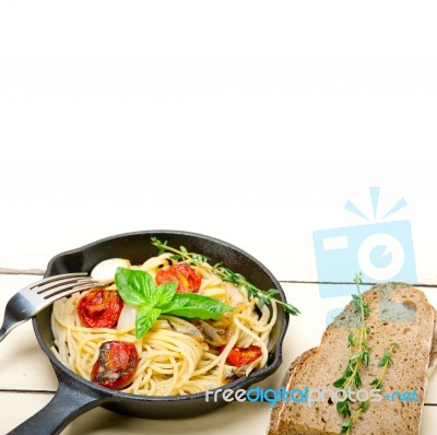 Spaghetti Pasta With Baked Cherry Tomatoes And Basil Stock Photo