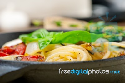 Spaghetti Pasta With Baked Cherry Tomatoes And Basil Stock Photo