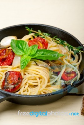 Spaghetti Pasta With Baked Cherry Tomatoes And Basil Stock Photo