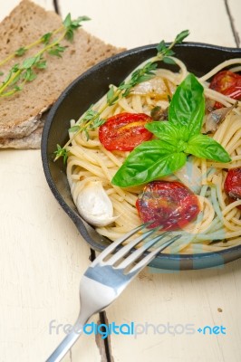 Spaghetti Pasta With Baked Cherry Tomatoes And Basil Stock Photo