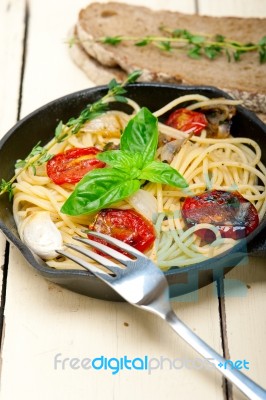 Spaghetti Pasta With Baked Cherry Tomatoes And Basil Stock Photo