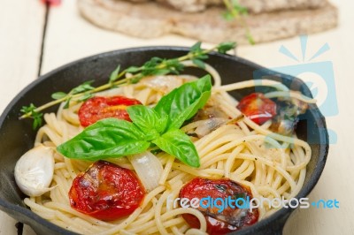 Spaghetti Pasta With Baked Cherry Tomatoes And Basil Stock Photo