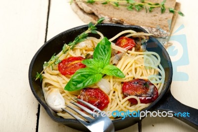 Spaghetti Pasta With Baked Cherry Tomatoes And Basil Stock Photo