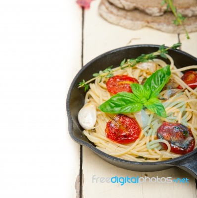 Spaghetti Pasta With Baked Cherry Tomatoes And Basil Stock Photo