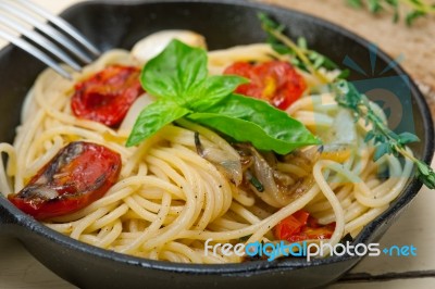 Spaghetti Pasta With Baked Cherry Tomatoes And Basil Stock Photo