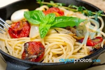 Spaghetti Pasta With Baked Cherry Tomatoes And Basil Stock Photo