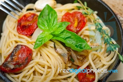 Spaghetti Pasta With Baked Cherry Tomatoes And Basil Stock Photo