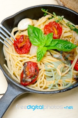 Spaghetti Pasta With Baked Cherry Tomatoes And Basil Stock Photo